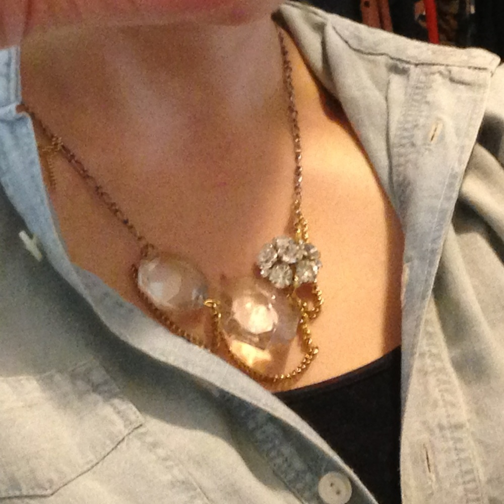 Necklace with vintage chains, charms, and gems